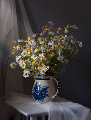 A Charming Floral Still Life Artwork Featuring Beautiful Daisies and a Ripe Apple