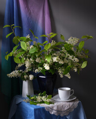 The Serene Still Life features a Book, fragrant Tea, and vibrant Flowers in harmony