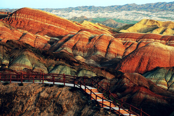 Amazing scenery of Rainbow mountain and blue sky background in sunset. Zhangye Danxia National Geopark, Gansu, China. Colorful landscape, rainbow hills, unusual colored rocks, sandstone erosion