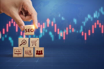 A hand builds a pyramid of marketing concept blocks, with SEO at the top, set against a global map...