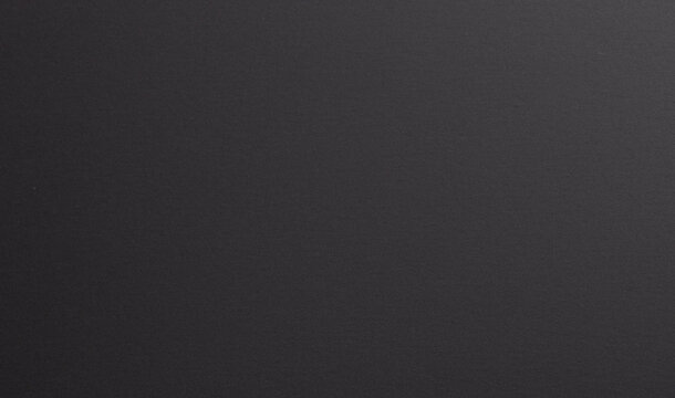 Premium black designer paper texture, with a fine, smooth surface. Monochrome, contemporary backdrop