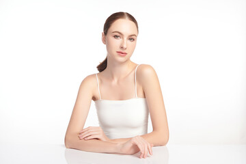 A beautiful young woman with clean, fresh skin against a white background. Skincare, facial...