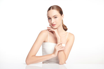 A beautiful young woman with clean, fresh skin against a white background. Skincare, facial...