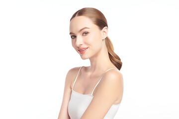 A beautiful young woman with clean, fresh skin against a white background. Skincare, facial...