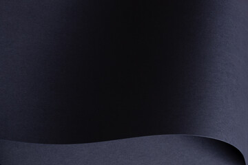 Premium designer paper texture. Dark navy blue surface with matte finish, creating an elegant,