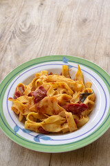 Homemade eggs tagliatelle with fresh tomato sauce