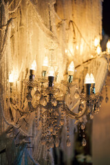 Elegant crystal chandelier with warm light decorative in wedding backdrop