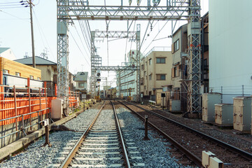 Urban railway track passing through residential building in Japan