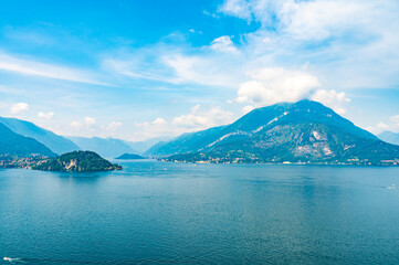 Panorama on Lake Como, with the villages of Tremezzina, Bellagio, Varenna and the mountains that overlook them, photographed in the evening.
