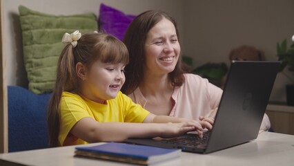 mother engaged school program home with her child digital laptop. parental assistance support learning. primary school tutor. children cheerful teacher. happy family. child kid mom computer. teamwork