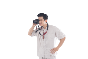 Photographer Taking Photo: A young man, casually dressed, attentively looks through his camera, capturing a moment. His relaxed posture suggests a hobby or passion.