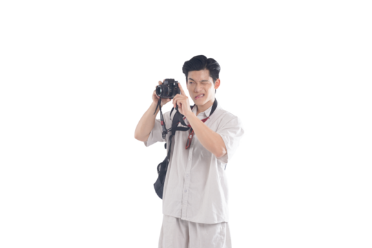 Photographer Capturing Moments: A young, smiling individual engrossed in photography, carefully adjusting a camera, highlighting a passion for capturing moments and visual storytelling. - Powered by Adobe
