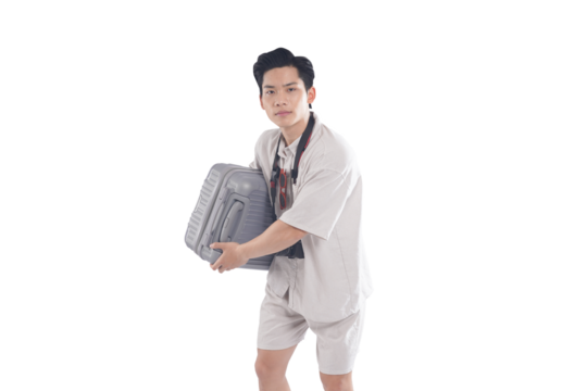 Preparing for Exploration: A young man, ready for adventure, strides forward with a suitcase, embodying the spirit of travel and discovery.