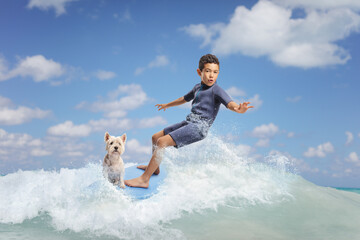 Kid in a wetsuit riding a surfboard