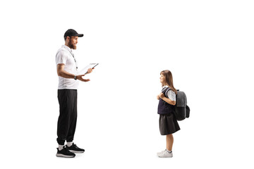 Physical education teacher talking to a schoolgirl