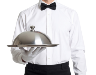 A waiter in formal attire holds a silver serving tray with a domed cloche, presenting it professionally.