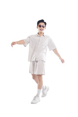 Asian guy wearing tourist clothes and sunglasses posing, travel concept