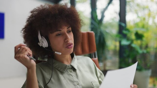 Woman tech support agent rolling her eyes while talking on phone, poor service