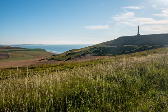 Cap Blanc-Nez, Escalles, Pas-de-Calais, Hauts-de-France, France, July 29th, 2025, A breathtaking and stunning coastal view featuring a prominent hill adorned with a tall tower against a clear blue sky