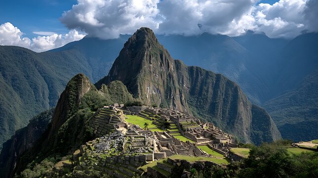 Majestic inca citadel of machu picchu nestled amongst verdant andean mountains under a dramatic sky