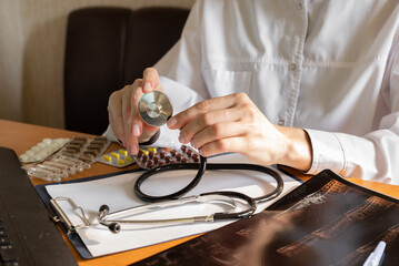Doctor discusses medication options while seated at a desk in a clinical office setting