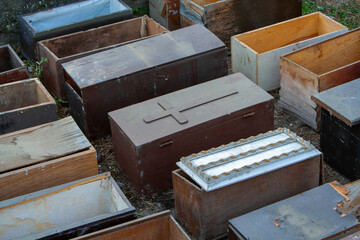 Old Wooden Coffins in Outdoor Storage