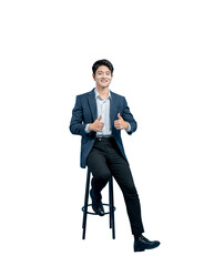 cheerful young Asian businessman in a suit gives two enthusiastic thumbs up, showing strong...