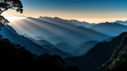 Sunlight shining through mountain ranges creating a beautiful landscape scene