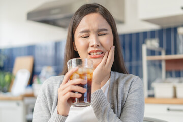 Close-up woman touching her cheek feeling sensitive teeth
