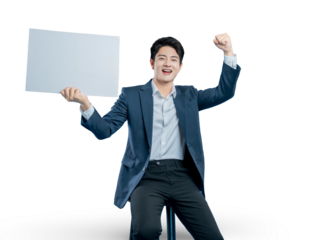 young businessman holds a blank sign and celebrates with a fist pump, announcing a great success, deal, or victory.