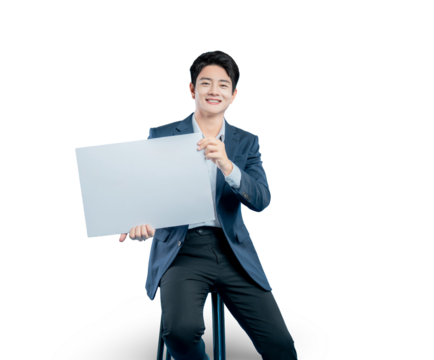 young Asian businessman holds a blank white sign for your message or advertisement while sitting on a stool against a PNG background