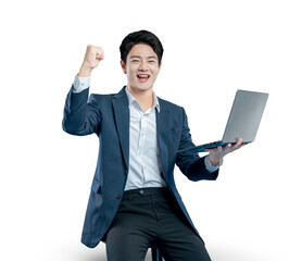 young businessman holds a laptop and celebrates a success, a winning bid, or good news with a...