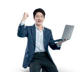 young businessman holds a laptop and celebrates a success, a winning bid, or good news with a triumphant fist pump.
