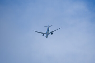 Passenger airplane is flying in clouds. 
