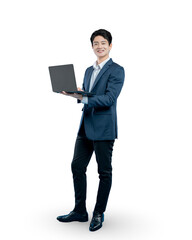 A confident young professional or businessman stands holding an open laptop and smiling at the camera. Isolated on PNG.