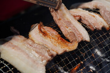 Juicy Pork Belly Grilling Over Hot Charcoal – Korean BBQ Close-Up