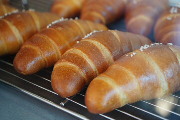Close-Up of Freshly Baked Salt Butter Rolls with Crusty Surface and Sea Salt on Top