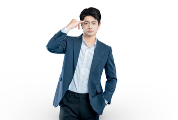 A serious young businessman points to his temple, representing concepts like thinking, strategy, focus, and intelligence.
