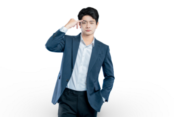 A serious young businessman points to his temple, representing concepts like thinking, strategy, focus, and intelligence.