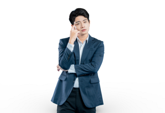 A pensive young professional with his finger to his temple is deep in thought, brainstorming a solution to a business problem.