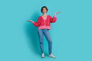 Full size photo of pretty young girl look unsure compare empty space wear trendy red outfit...