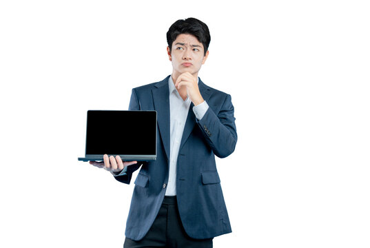 A pensive young professional holds a laptop and looks thoughtful, contemplating a problem or technical issue.
