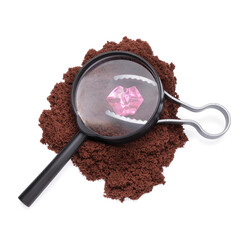 Toy magnifying glass, tweezers with pink stone on kinetic sand isolated on white background, design element, children's game