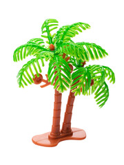 Toy palm tree made of plastic isolated on white background
