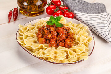 Italian pasta Farfalle Bolognese with meat