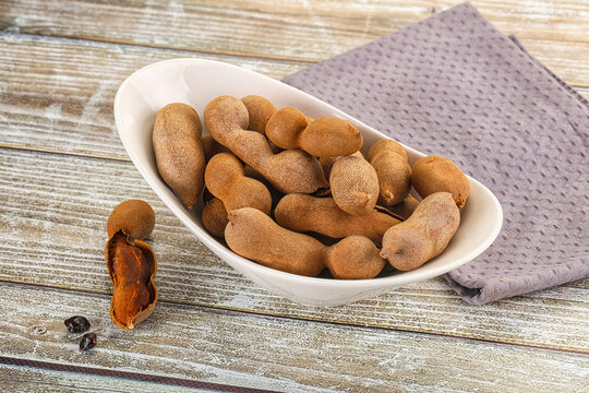 Tropical exotic Tamarind fruit heap