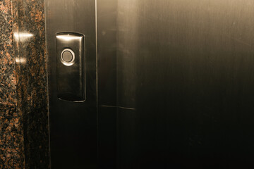 Elevator call button in residential building interior