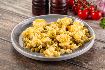 Scrambled egg omelet with green peas