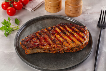Grilled pork steak with bone