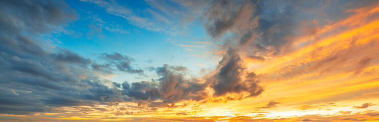 Rain clouds and evening sky,Amazing sunset skyscape. Evening sky with bright colorful orange and...